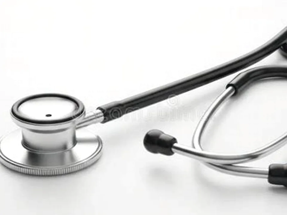 Editorial photograph of a stethoscope on a modern medical surface